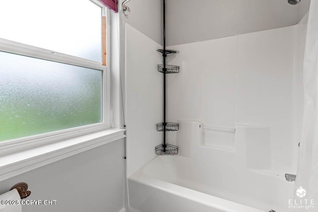 bathroom with plenty of natural light and shower / bath combination