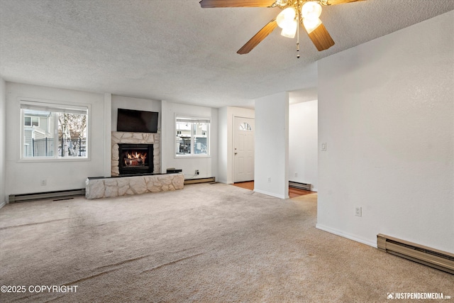 unfurnished living room featuring a fireplace, a baseboard radiator, and light colored carpet