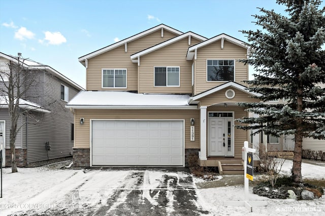 view of front of property with a garage