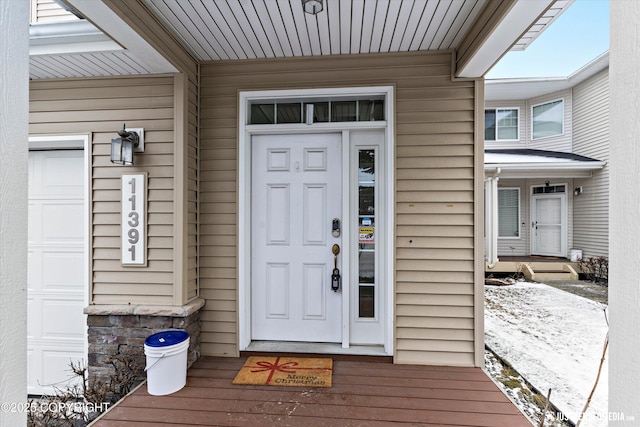 view of snow covered property entrance