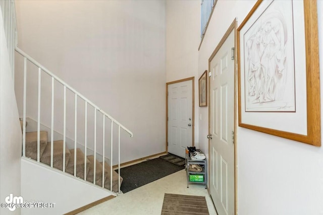 entryway featuring a high ceiling