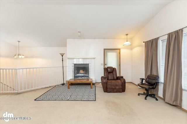 carpeted living room with a fireplace and vaulted ceiling