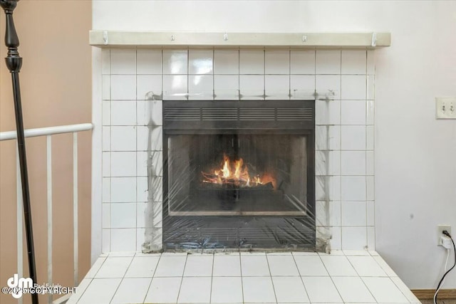 room details featuring a tiled fireplace