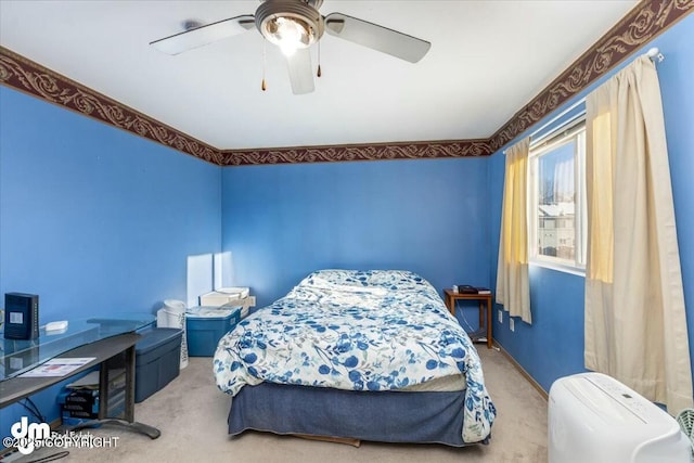 bedroom featuring ceiling fan and light colored carpet