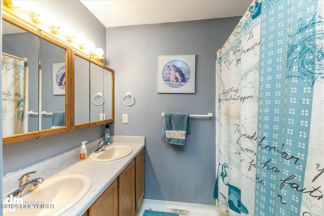 bathroom with vanity and a shower with shower curtain