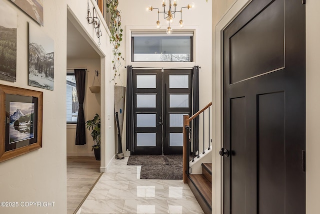 foyer featuring an inviting chandelier