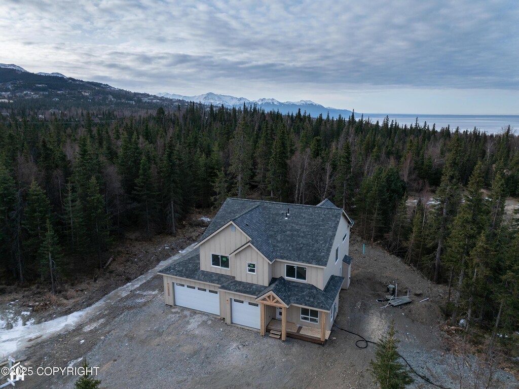 14566 Rockingham Cir, Anchorage, AK 99516 - drone / aerial view with a forest view and a mountain view