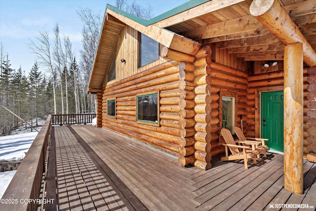 view of snow covered deck