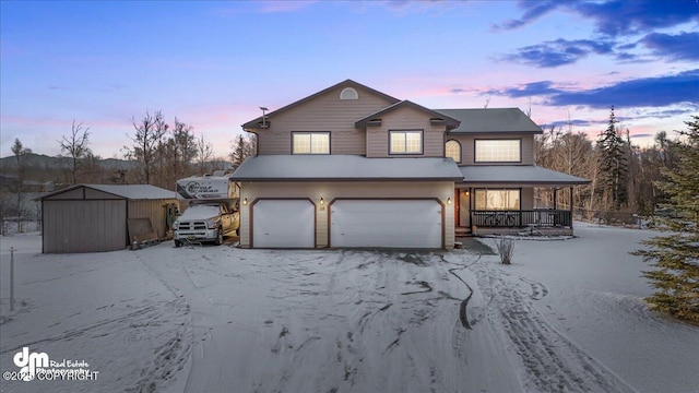 view of front of house with a garage and covered porch