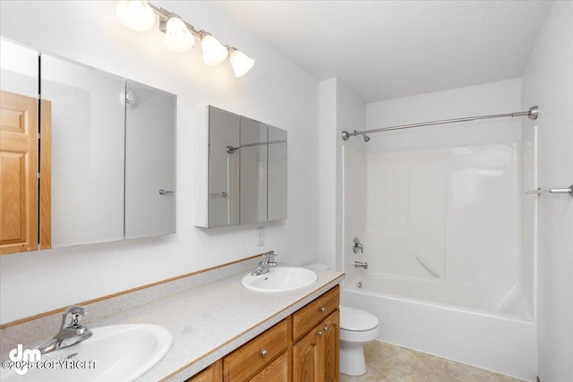 full bathroom with vanity, shower / bathtub combination, and toilet