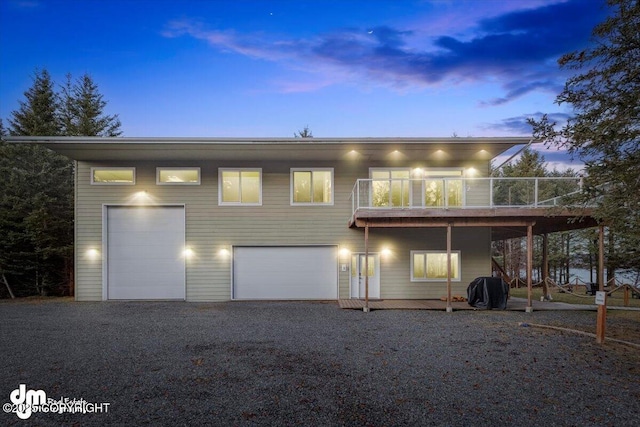 contemporary house featuring a balcony and a garage