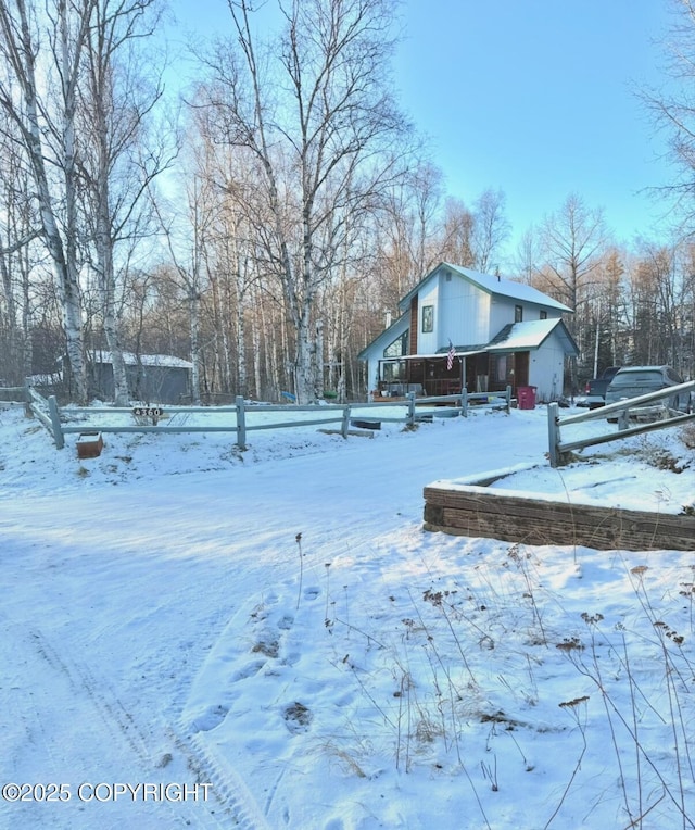 view of yard layered in snow