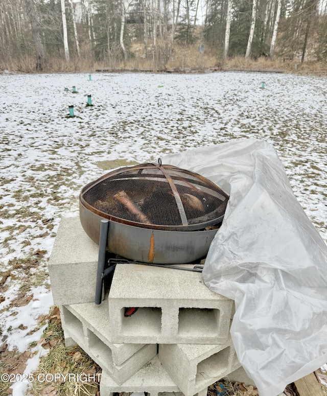 details featuring an outdoor fire pit