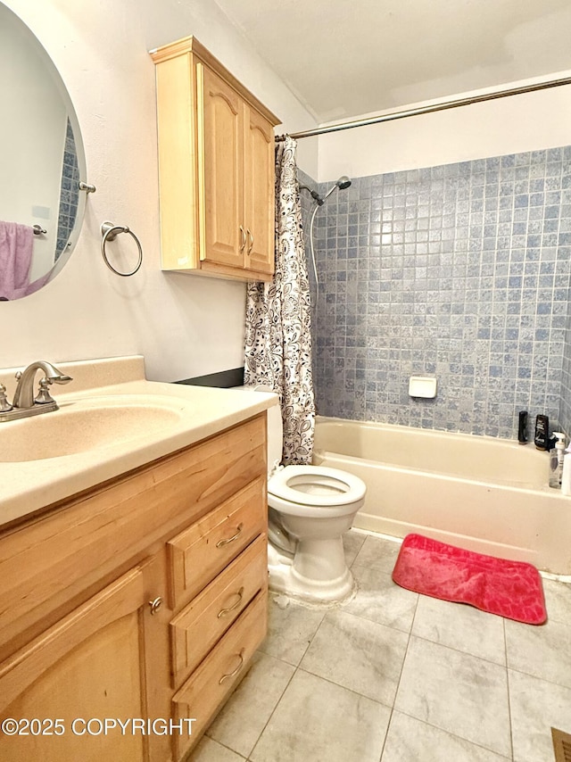 bathroom featuring toilet, tile patterned flooring, shower / bath combo with shower curtain, and vanity