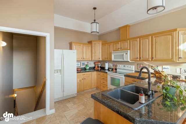kitchen with sink, white appliances, decorative light fixtures, kitchen peninsula, and light brown cabinets