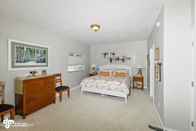 bedroom featuring light carpet