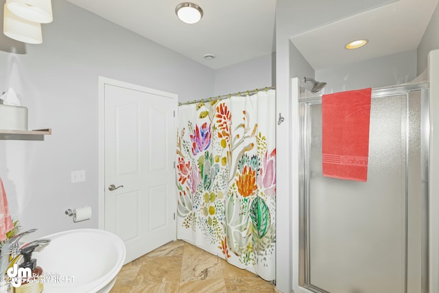 bathroom with sink and walk in shower