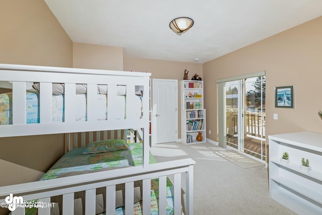 carpeted bedroom featuring access to exterior