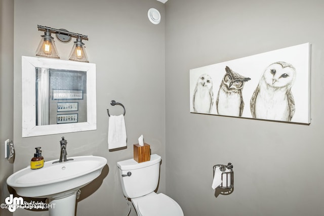 bathroom with sink and toilet
