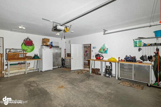 garage featuring a garage door opener and a workshop area