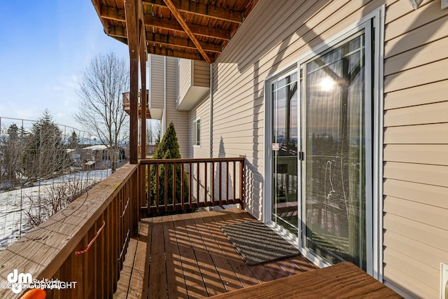 view of snow covered deck