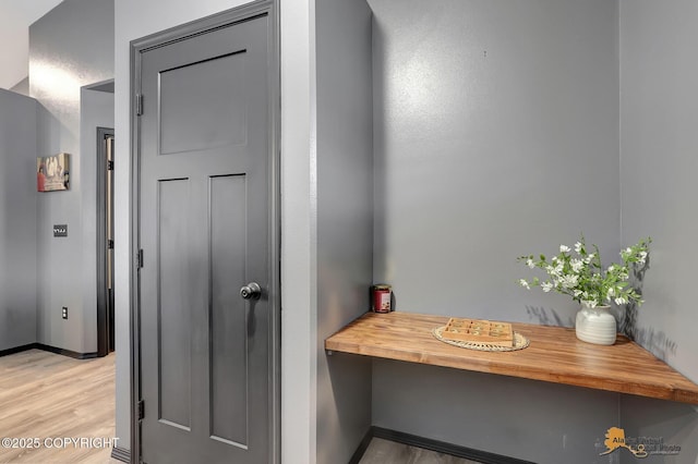 hallway featuring wood-type flooring