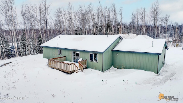 view of snow covered house