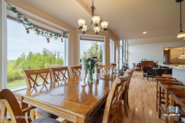 dining room featuring a chandelier, light wood-type flooring, and recessed lighting