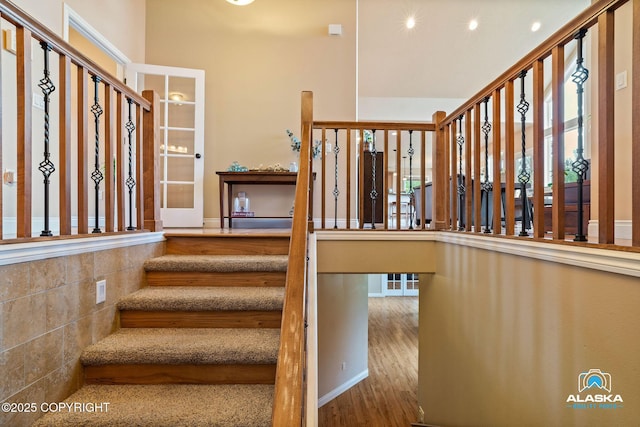 stairway with wood finished floors