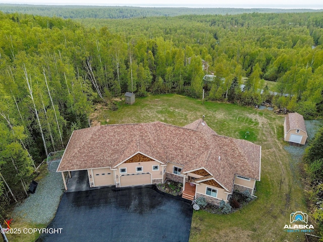 view of subject property featuring a forest