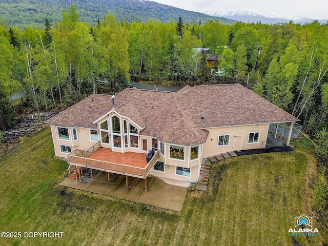 view from above of property with a forest