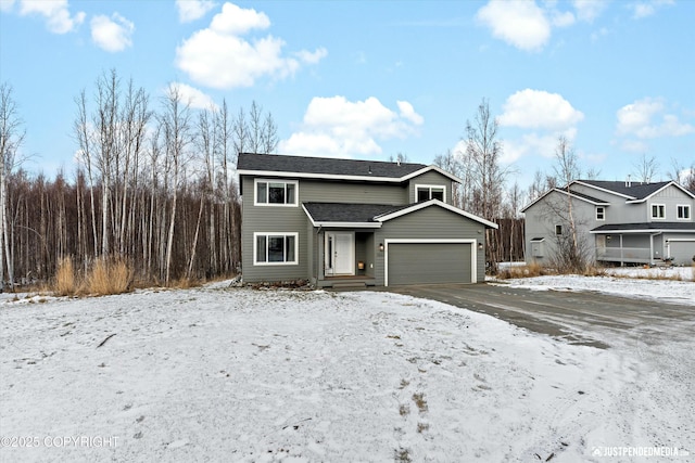 view of front of property with a garage and roof with shingles