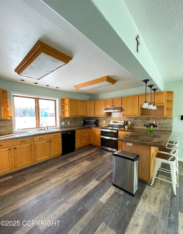 kitchen with open shelves, appliances with stainless steel finishes, a sink, and under cabinet range hood