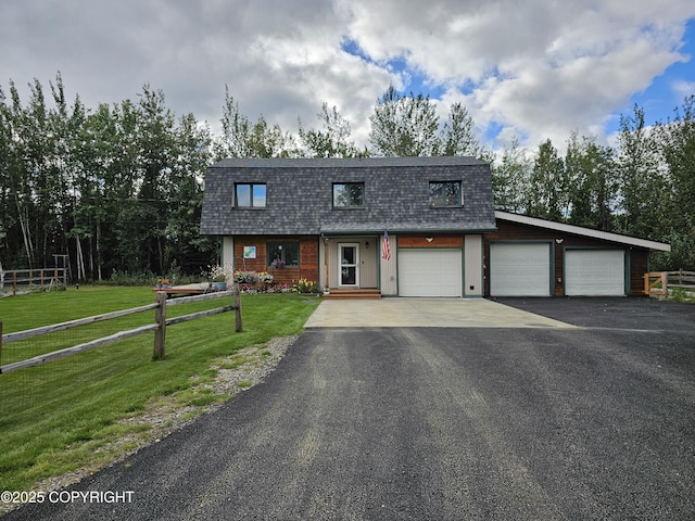 view of front of house with aphalt driveway, a shingled roof, a front yard, fence, and a garage