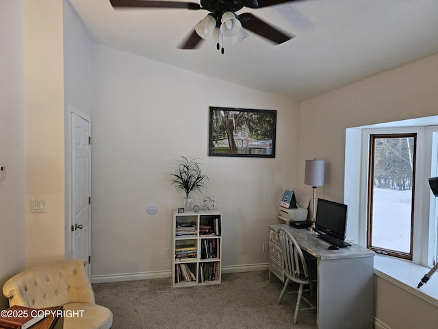 office area with a ceiling fan, carpet, vaulted ceiling, and baseboards