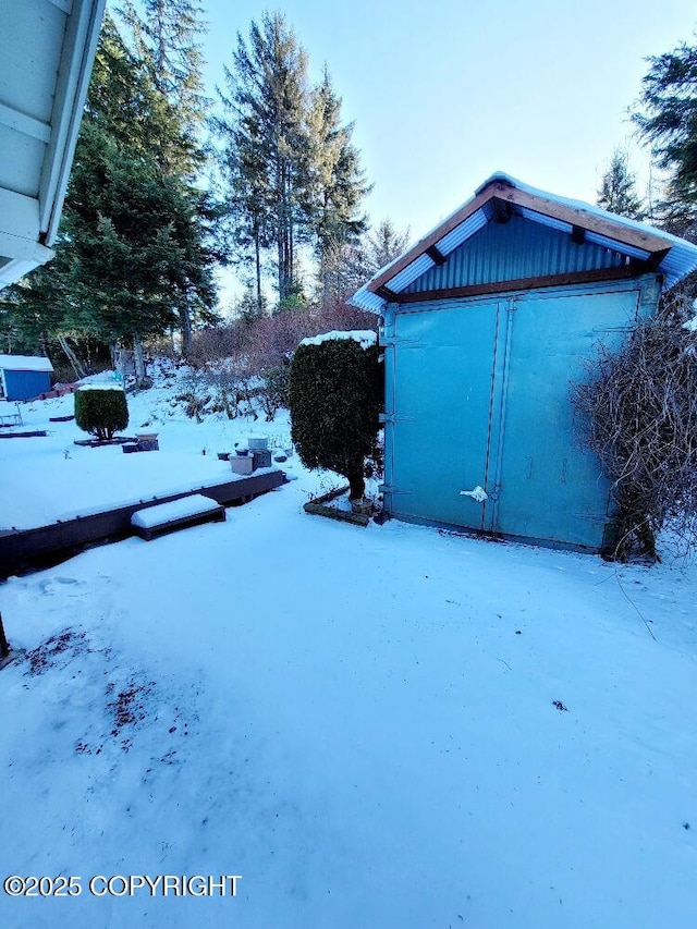 view of yard layered in snow