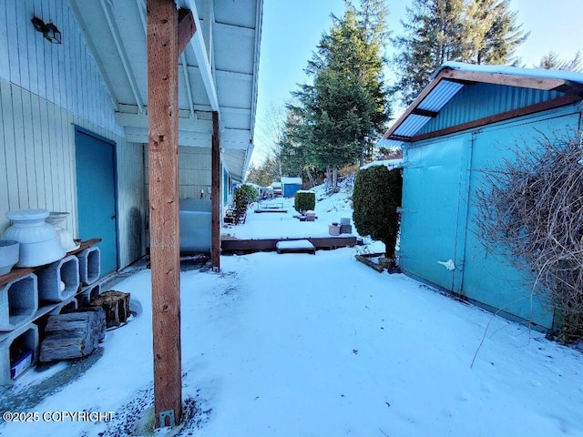 view of yard layered in snow