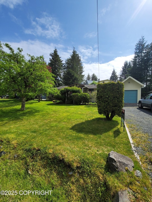 223 Lakeview Dr, Sitka, AK 99835 - view of grassy yard with an outbuilding and a garage