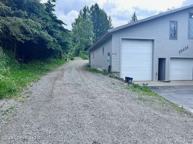 12421 Silver Spruce Dr, Anchorage, AK 99516 - view of property exterior with a garage