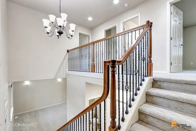 staircase with an inviting chandelier, baseboards, carpet flooring, and recessed lighting