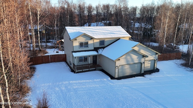 view of front of home featuring fence