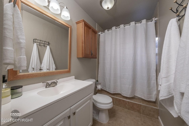 bathroom featuring tile patterned floors, vanity, and toilet