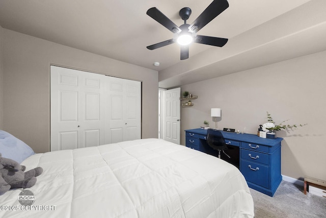 bedroom with light carpet, ceiling fan, and a closet