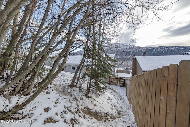 snow covered property featuring a mountain view