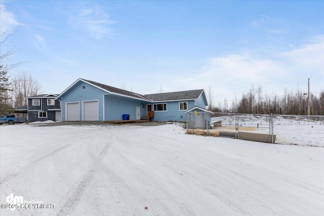 single story home featuring a garage