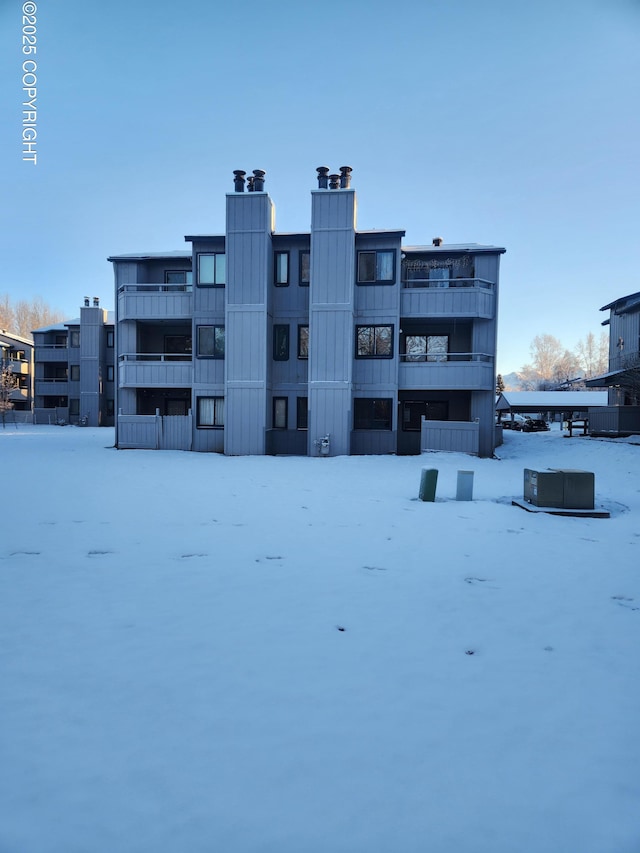 view of snow covered property