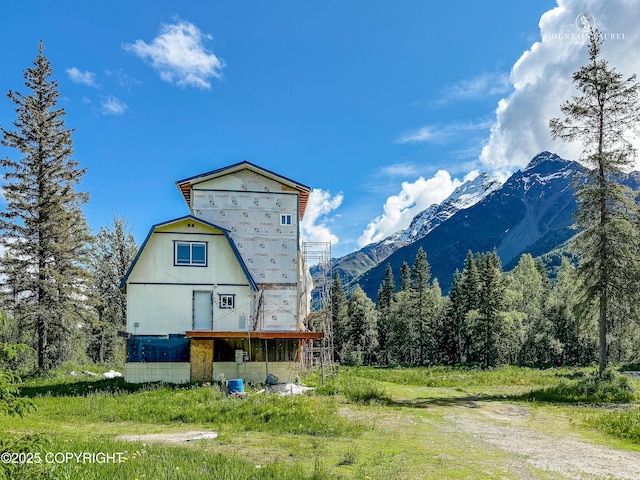 8630 S River Dr, Palmer, AK 99645 - back of property with a mountain view and a wooded view