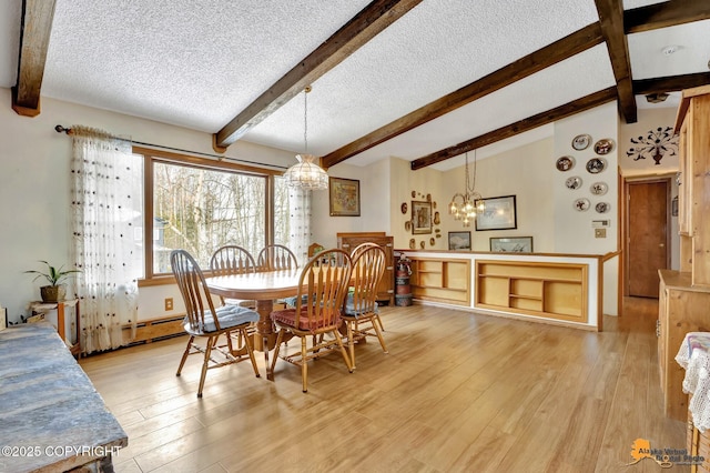 dining room with light hardwood / wood-style floors, a textured ceiling, and lofted ceiling with beams