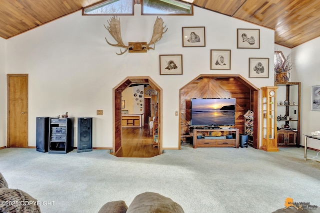 carpeted living room featuring high vaulted ceiling and wood ceiling