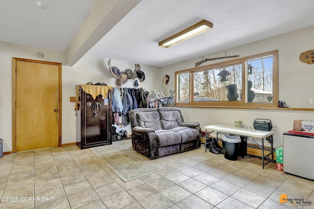 interior space featuring light tile patterned floors and baseboard heating